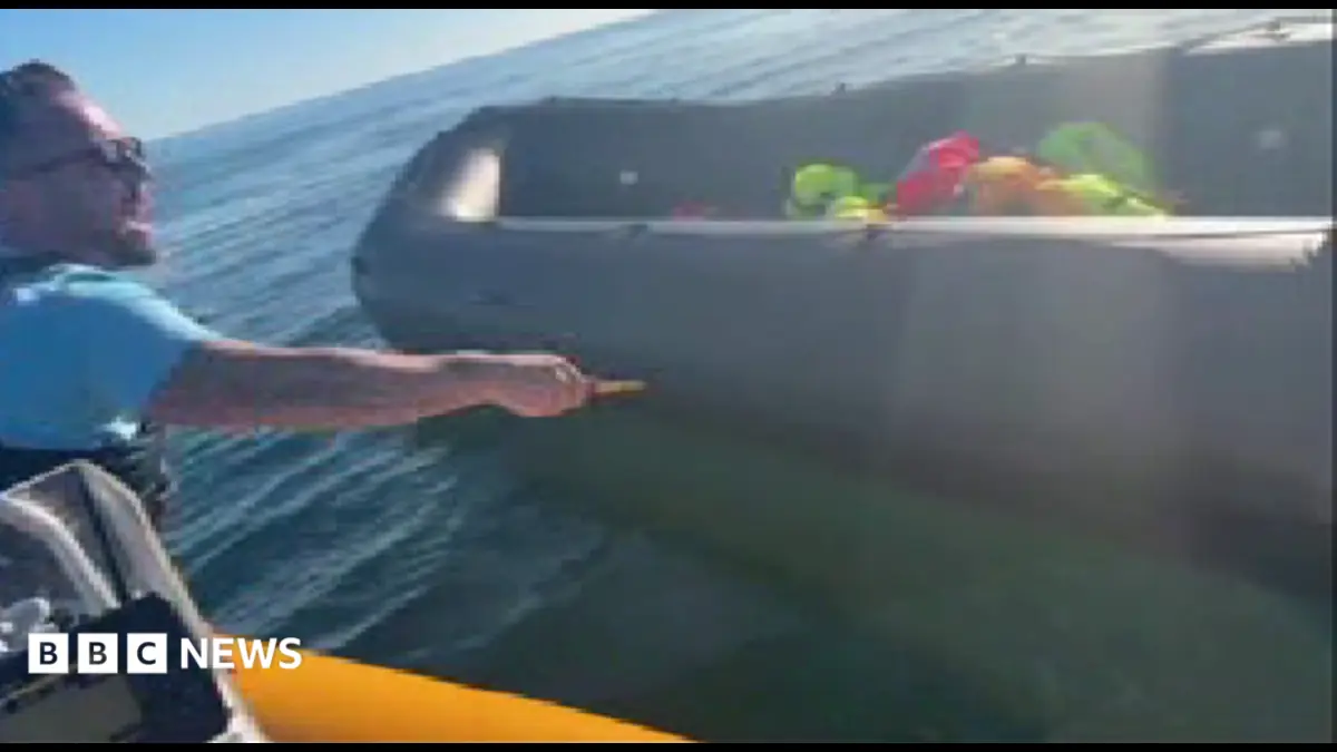 Police examine video of anti-migrant activist slashing dinghy with knife